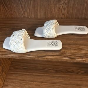 Vince Camuto, flat slip on sandals in creamy white color.